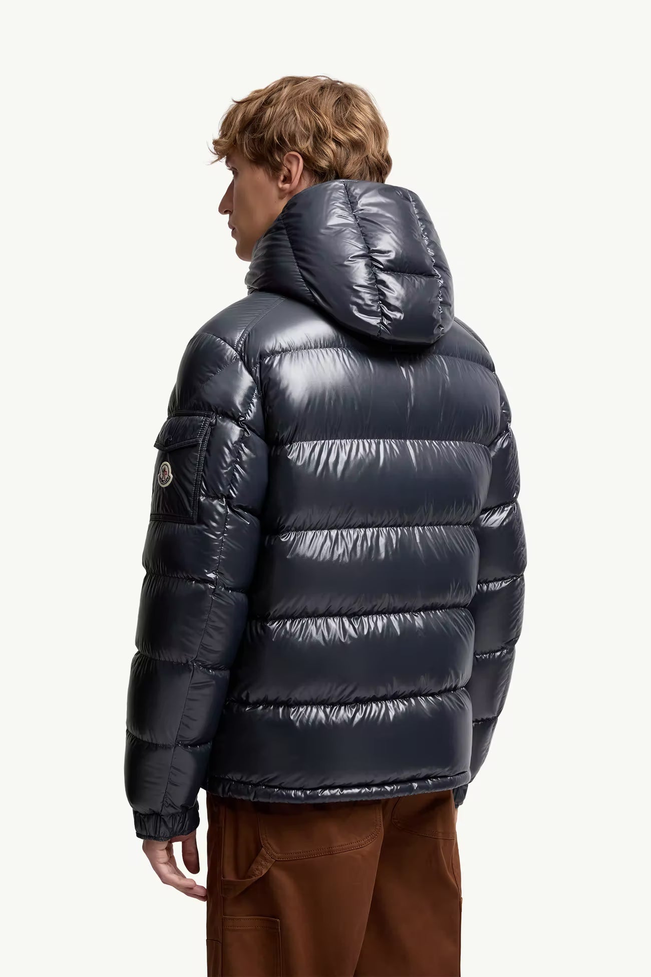 Moncler Maya Dark Navy Jacket - Back view on male model showing quilted down construction and hood