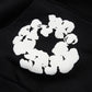 Denim Tears Cotton Wreath Black White Hoodie - close-up fabric and branding detail