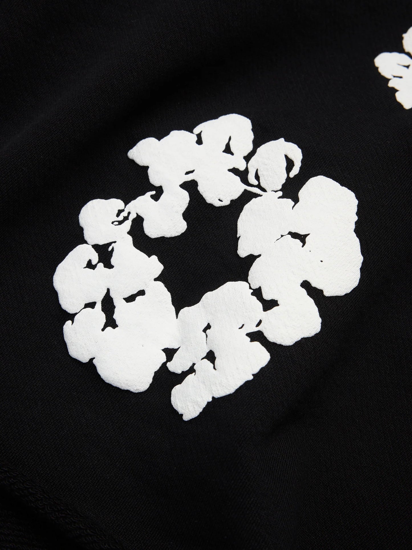 Denim Tears Cotton Wreath Black White Shorts - close-up fabric and branding detail