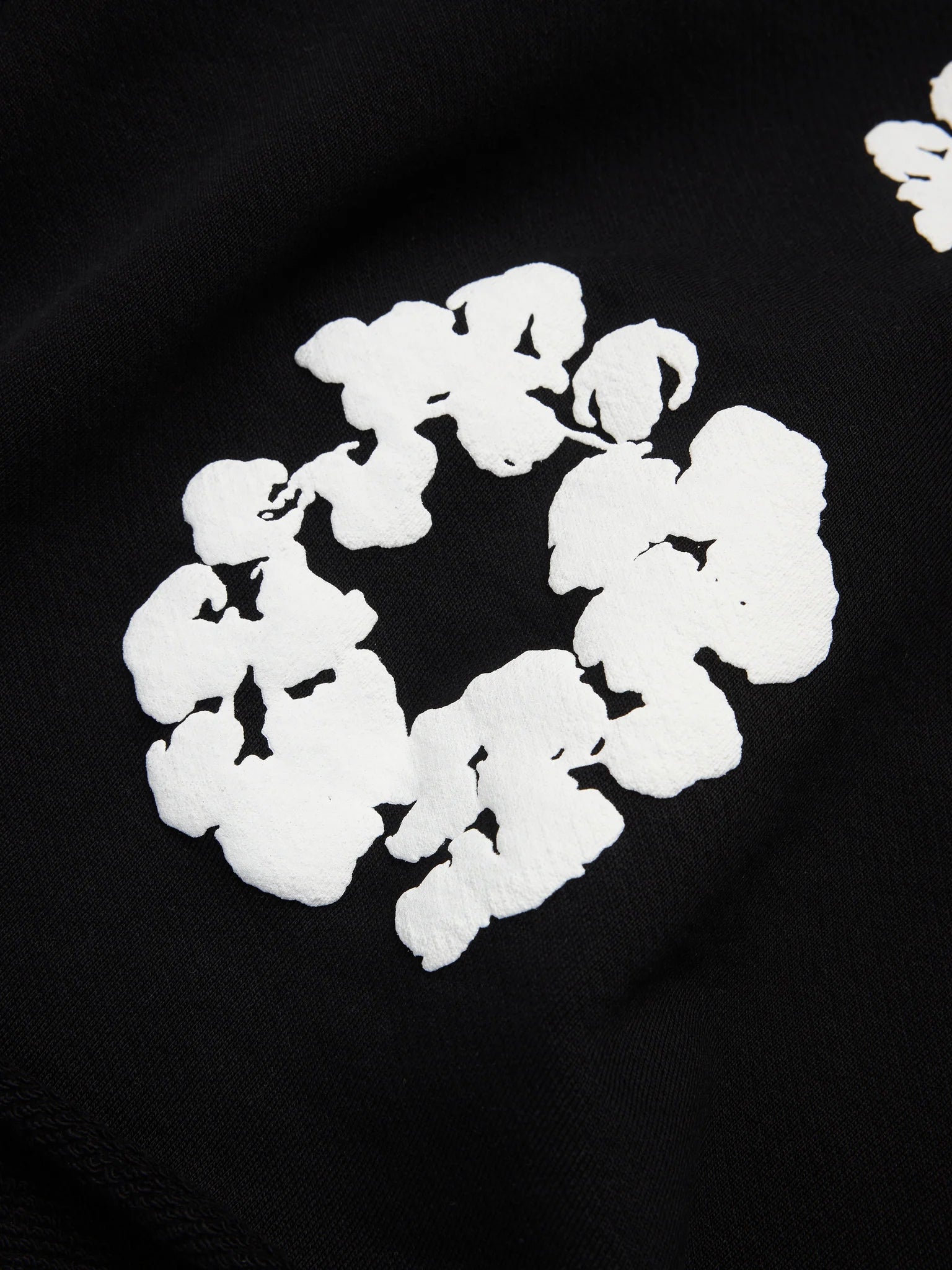 Denim Tears Cotton Wreath Black White Shorts - close-up fabric and branding detail