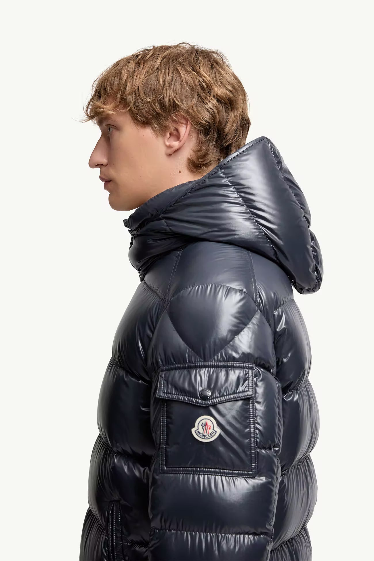 Moncler Maya Dark Navy Jacket - Side profile view on male model showing Moncler badge and quilted detail