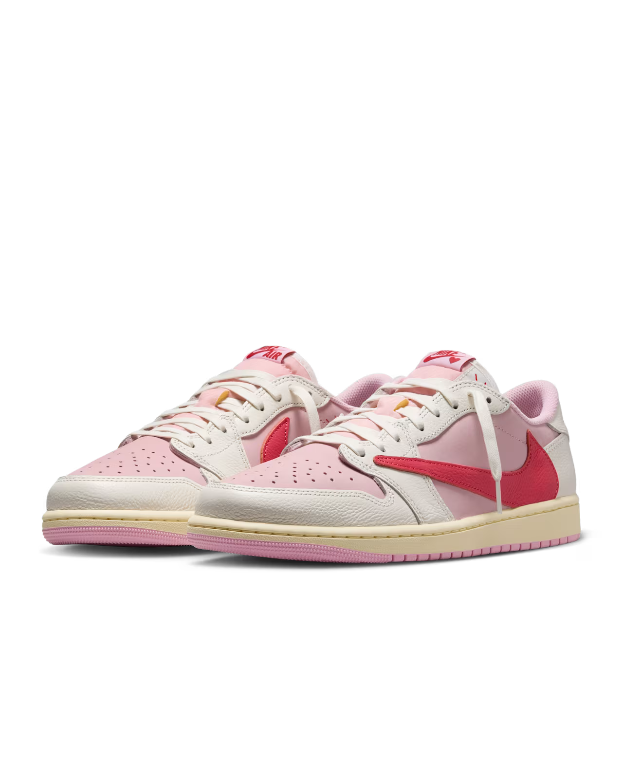 Pair of Travis Scott Air Jordan 1 Low Tropical Pink sneakers showing full design and colorway